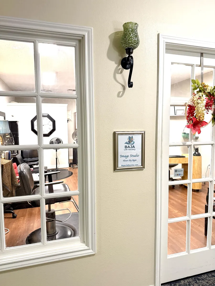 The BAJA Life Society Image Studio sign beside the studio door, hours by appointment